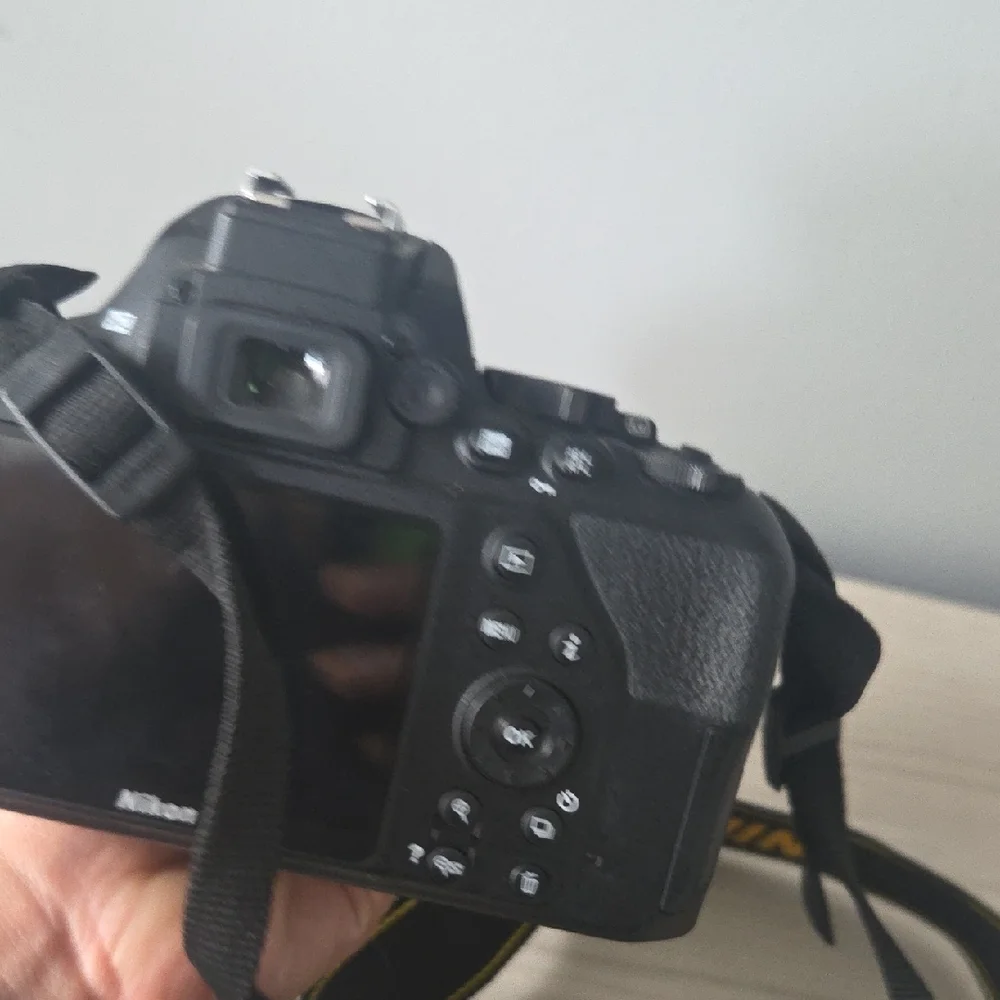 Nikon Black Camera D3500 with Zoom Lens and Black/Yellow Strap/ Charger Included